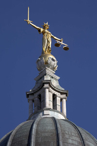 statue of Justice, atop the High Court in London